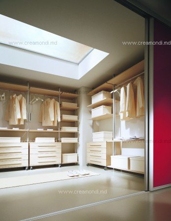 Wardrobe systemsSilver framework gives the lightness to the room